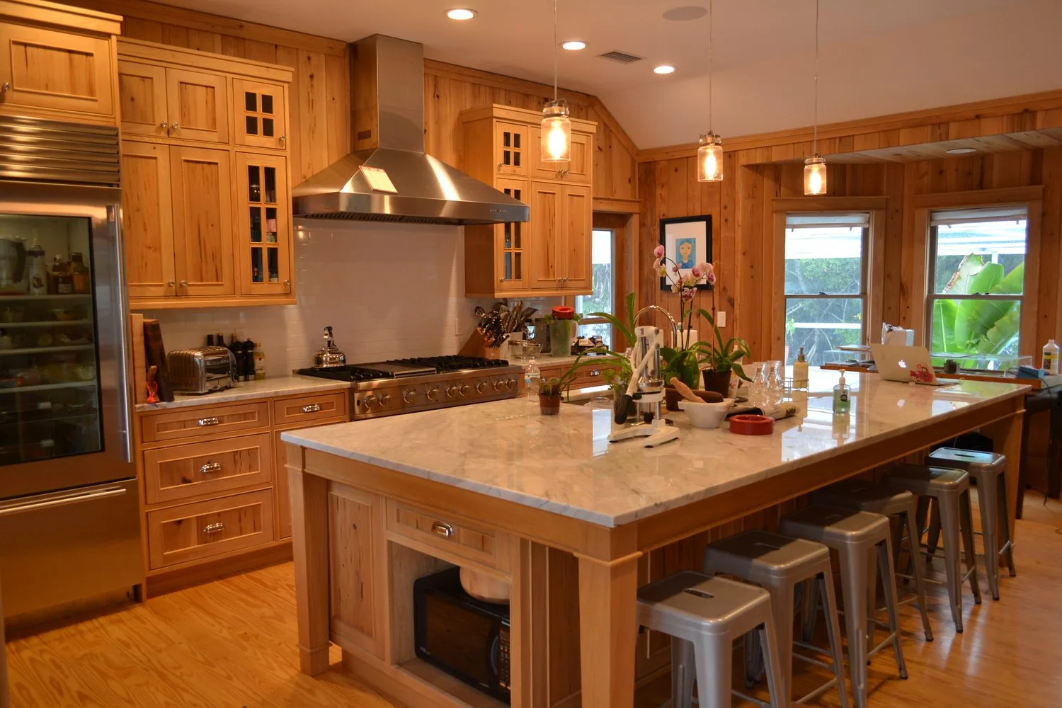 Custom hickory kitchen with marble island by Elite Woodwork